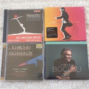 CDs. (4) BRAND NEW and unwrapped. Perfect gifts.